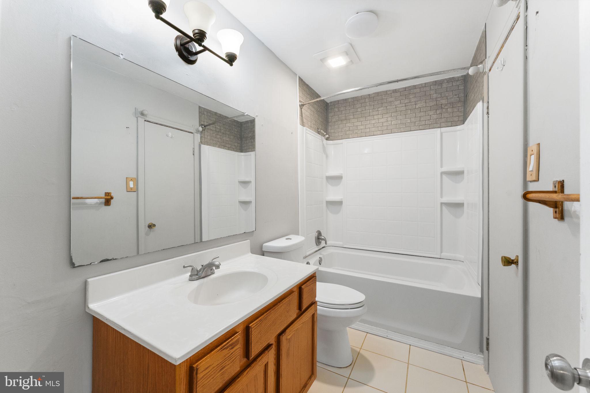 14489 Golden Oak Road Centreville, VA 20121 - Photo 14 of 27 a bathroom with a sink toilet tub and shower