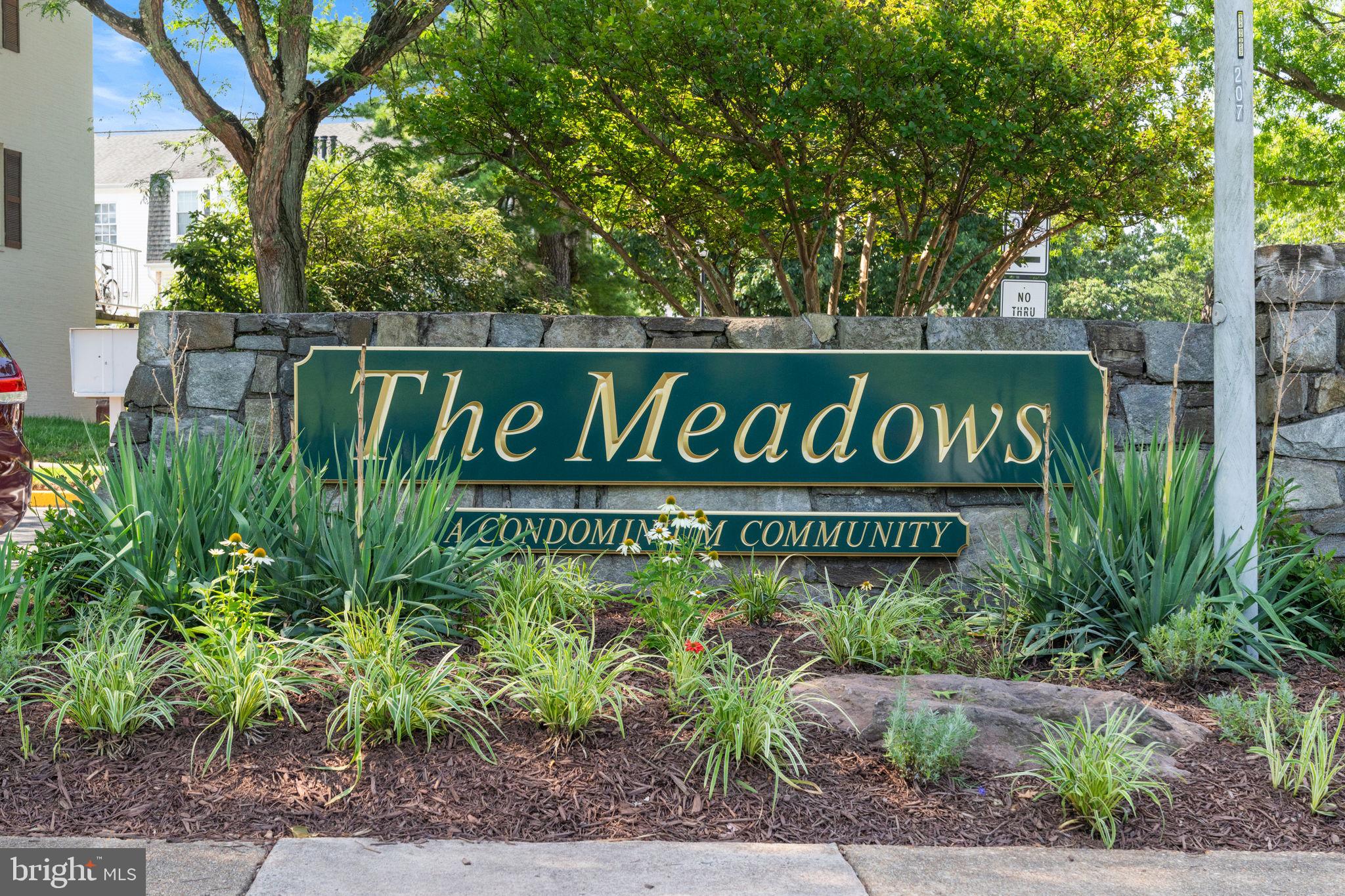 14489 Golden Oak Road Centreville, VA 20121 - Photo 23 of 27 a sign broad in front of the red brick house