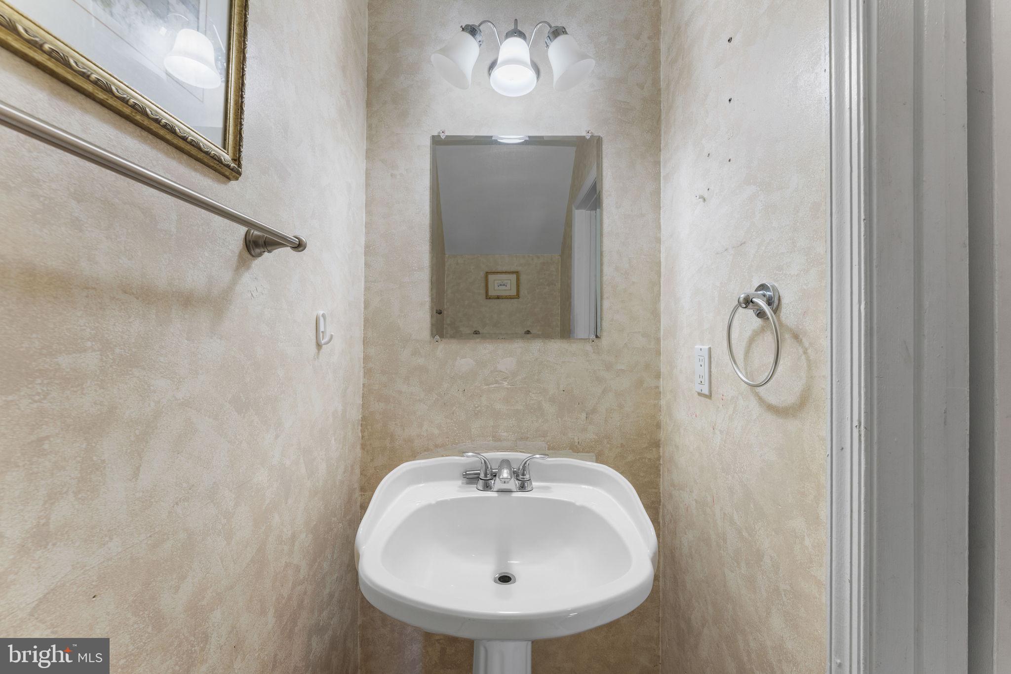 14489 Golden Oak Road Centreville, VA 20121 - Photo 10 of 27 a bathroom with a sink and mirror