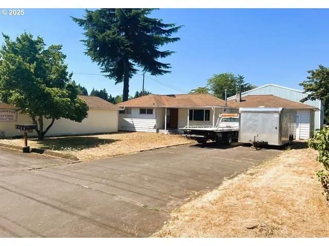 a view of a house with a tree