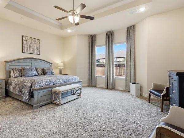 a bedroom with a bed and a chair