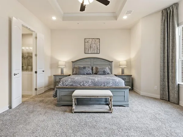 a bedroom with a bed and a cabinets