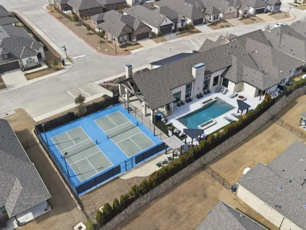 an aerial view of residential houses with outdoor space