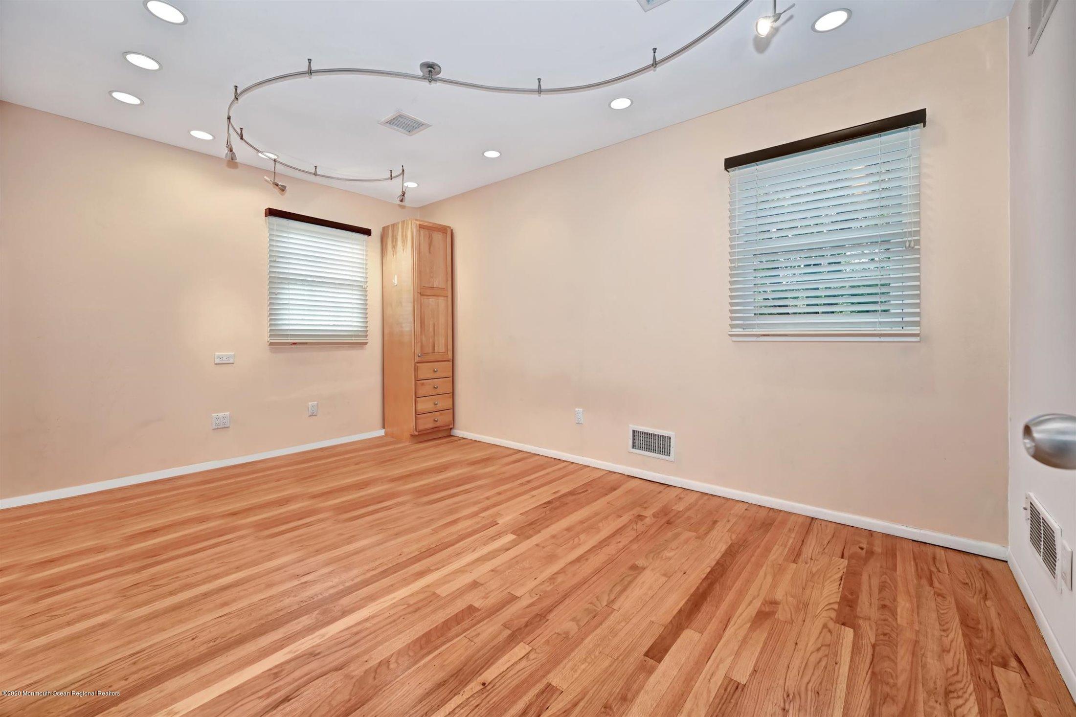 4 Canadian Woods Road Marlboro, NJ 07746 - Photo 20 of 33 a view of empty room with wooden floor and fan