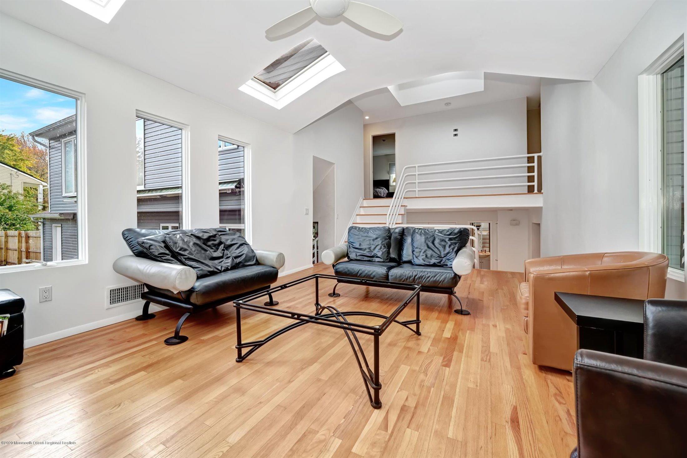 4 Canadian Woods Road Marlboro, NJ 07746 - Photo 5 of 33 a living room with furniture and a wooden floor