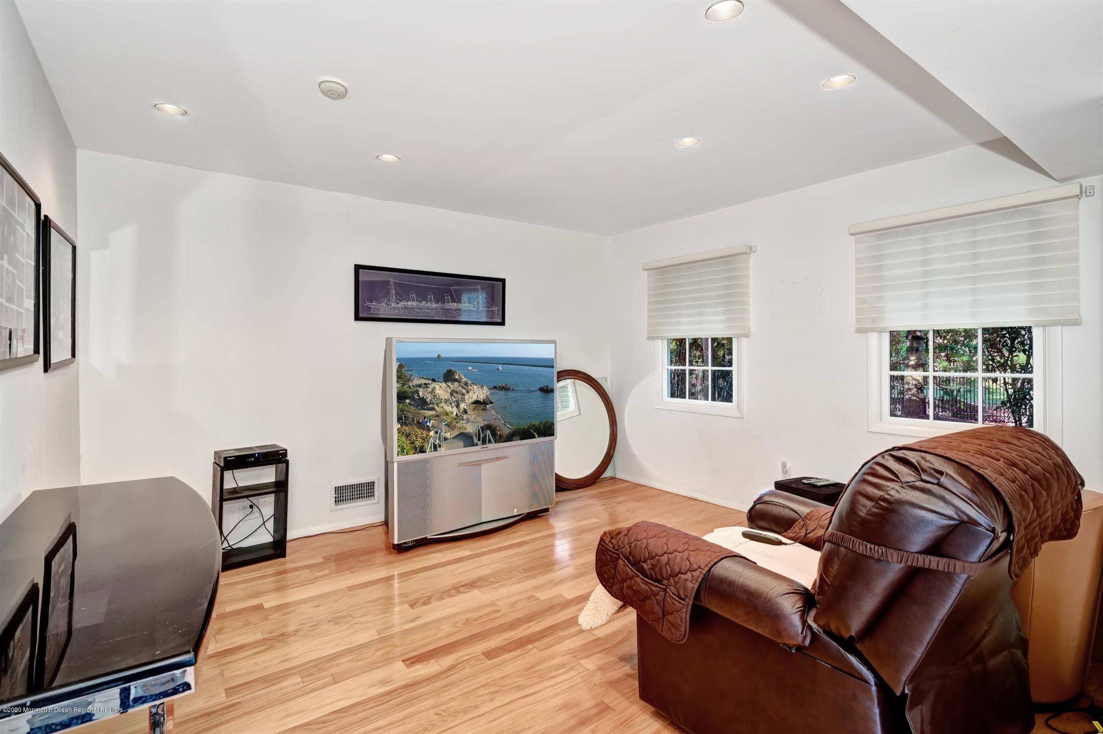 4 Canadian Woods Road Marlboro, NJ 07746 - Photo 6 of 33 a living room with furniture and a flat screen tv