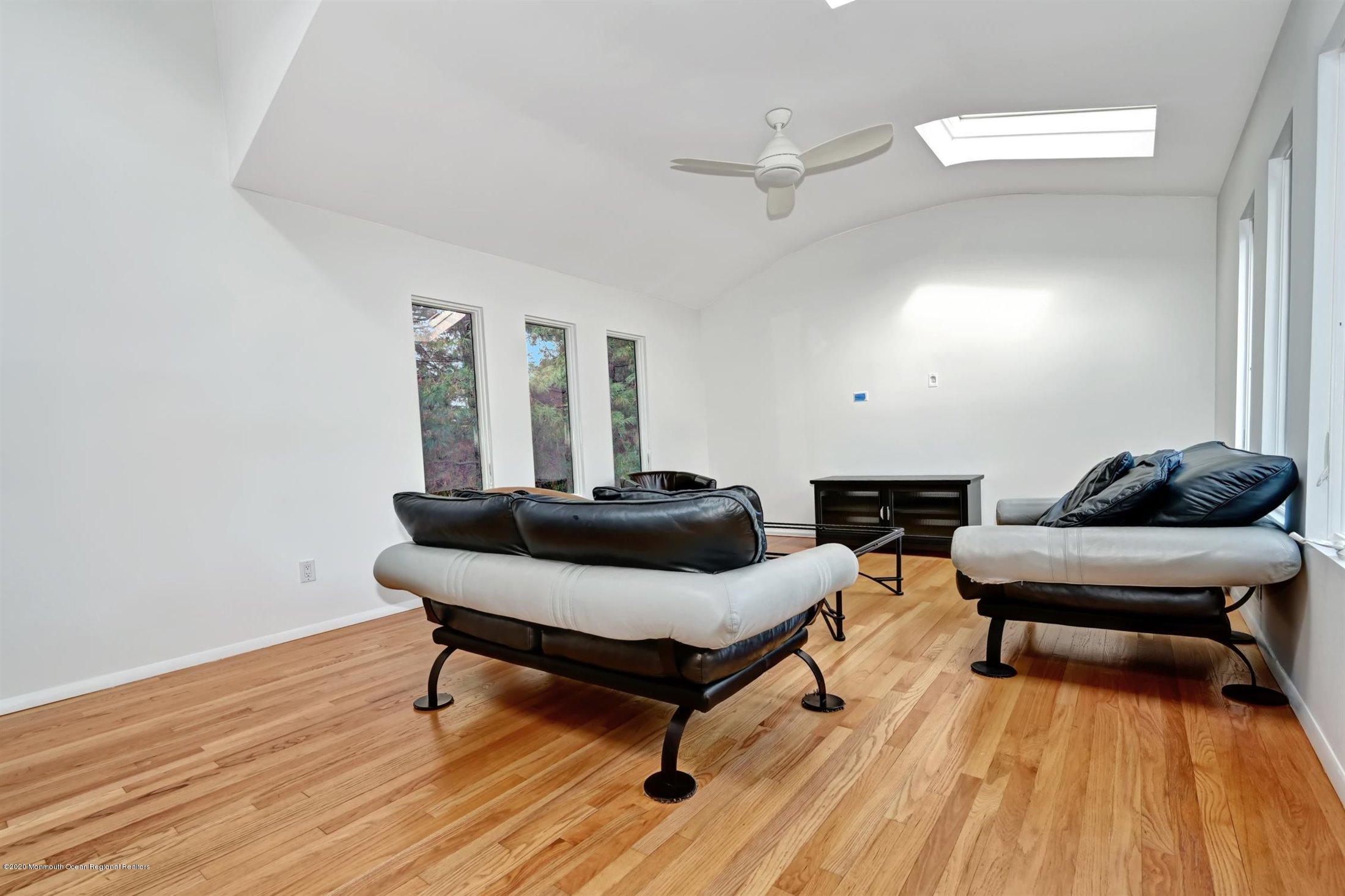 4 Canadian Woods Road Marlboro, NJ 07746 - Photo 7 of 33 a living room with furniture and a wooden floor