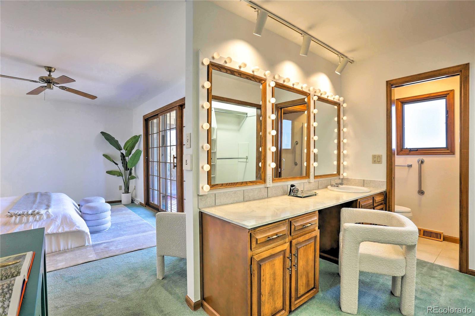 4452 South Xeric Way Denver, CO 80237 - Photo 16 of 40 a hall with a sink and a table