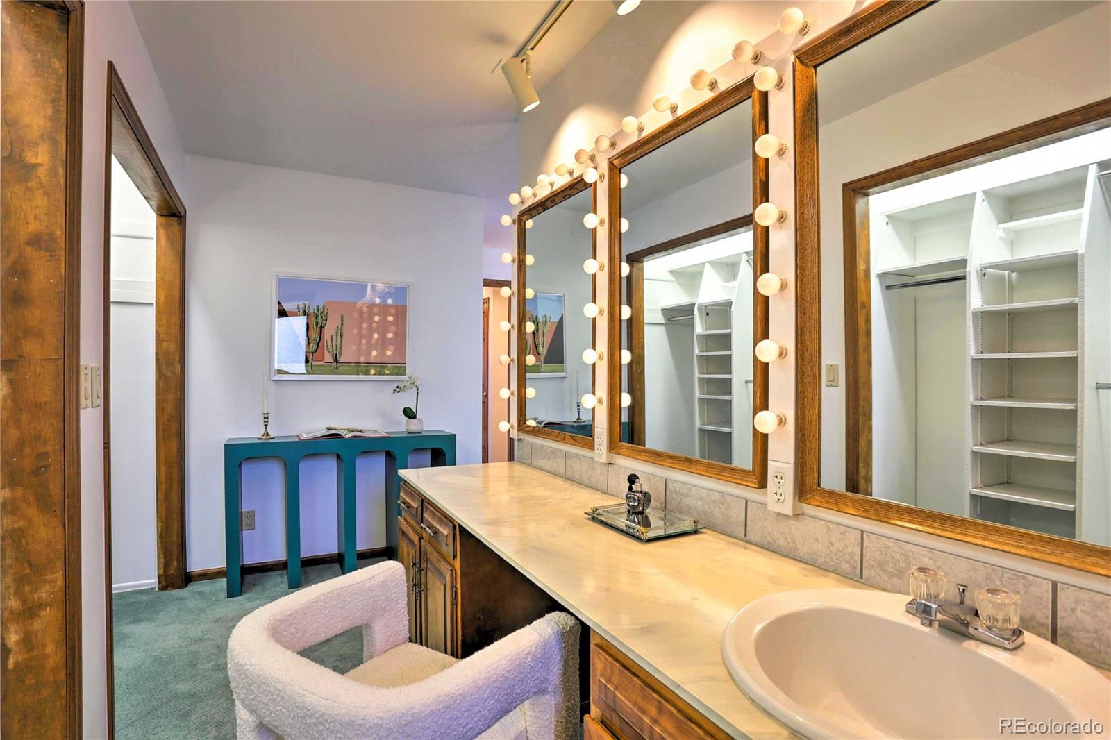 4452 South Xeric Way Denver, CO 80237 - Photo 17 of 40 a bathroom with a granite countertop sink mirror and a bathtub
