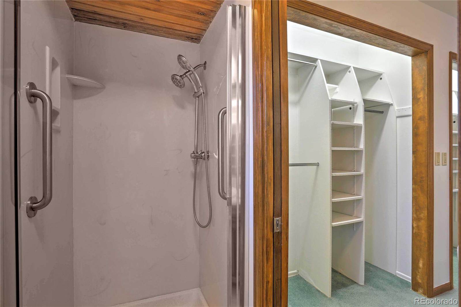 4452 South Xeric Way Denver, CO 80237 - Photo 18 of 40 a bathroom with a glass shower door