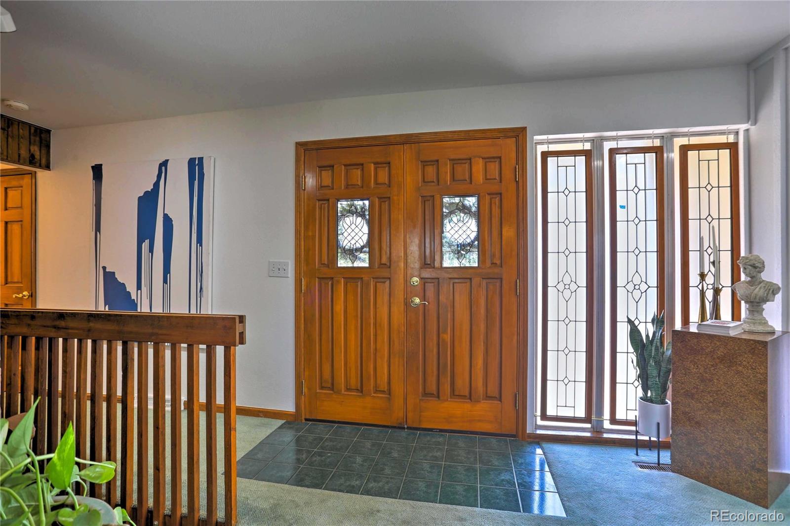 4452 South Xeric Way Denver, CO 80237 - Photo 2 of 40 a view of a room with wooden floor and windows