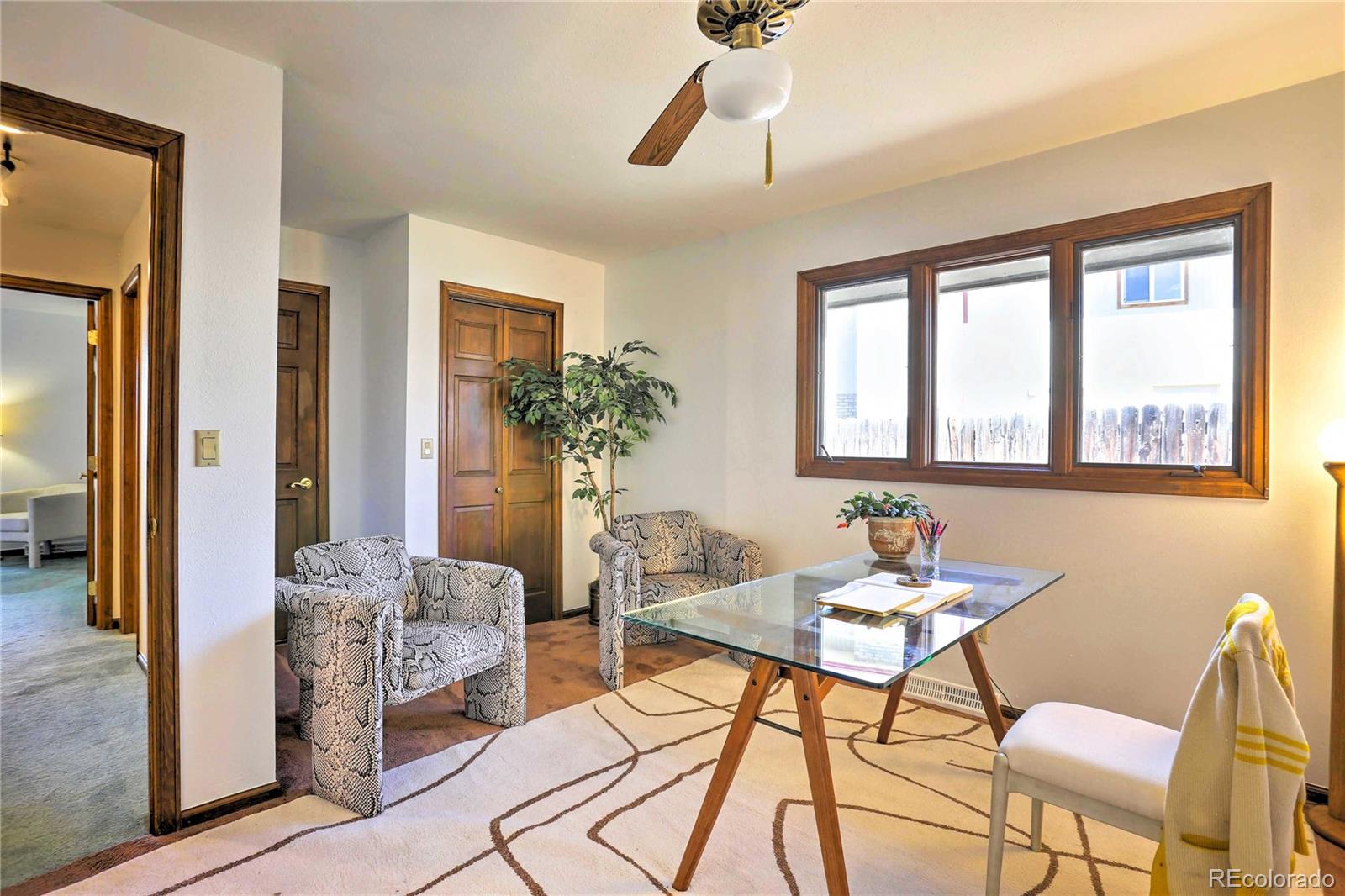 4452 South Xeric Way Denver, CO 80237 - Photo 23 of 40 a living room with furniture and a large window