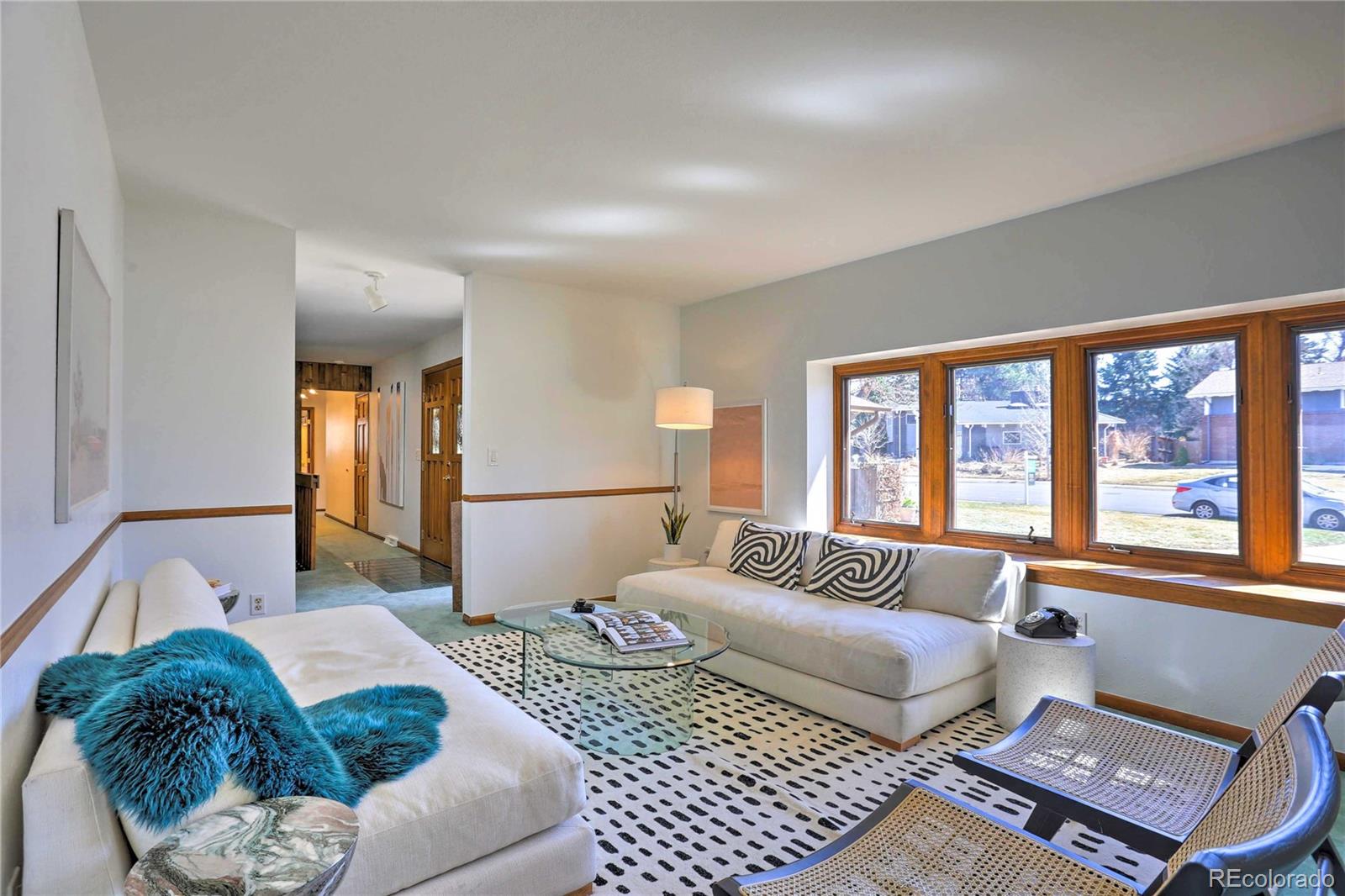 4452 South Xeric Way Denver, CO 80237 - Photo 3 of 40 a bedroom with furniture and a large window