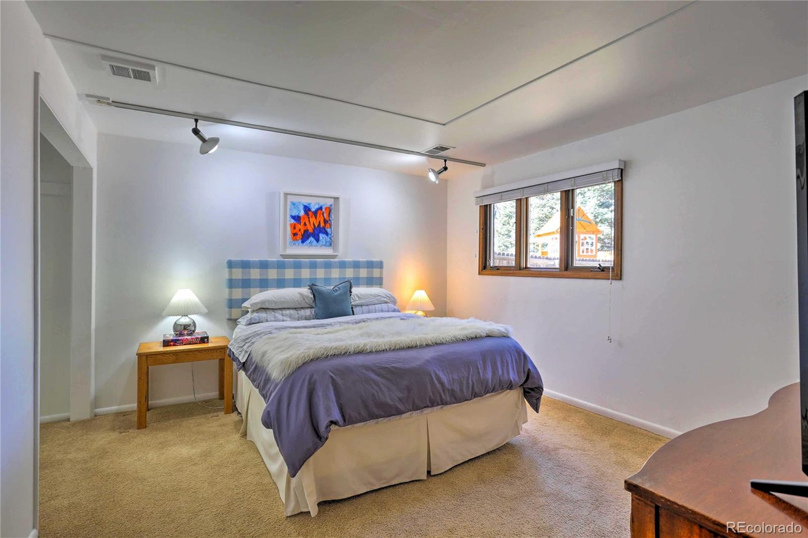 4452 South Xeric Way Denver, CO 80237 - Photo 33 of 40 a bedroom with a bed and a window