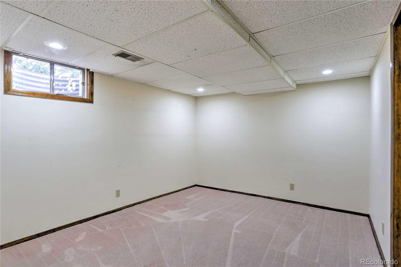 4452 South Xeric Way Denver, CO 80237 - Photo 35 of 40 an empty room with windows