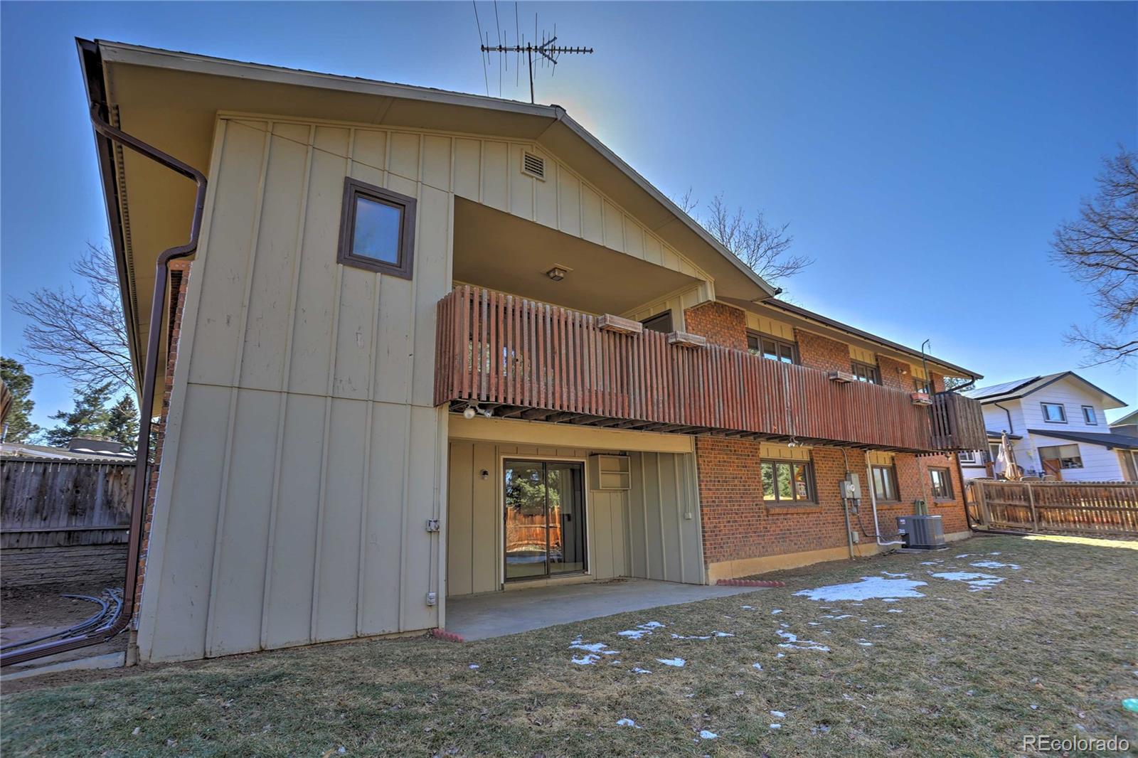 4452 South Xeric Way Denver, CO 80237 - Photo 39 of 40 a front view of a house with a yard