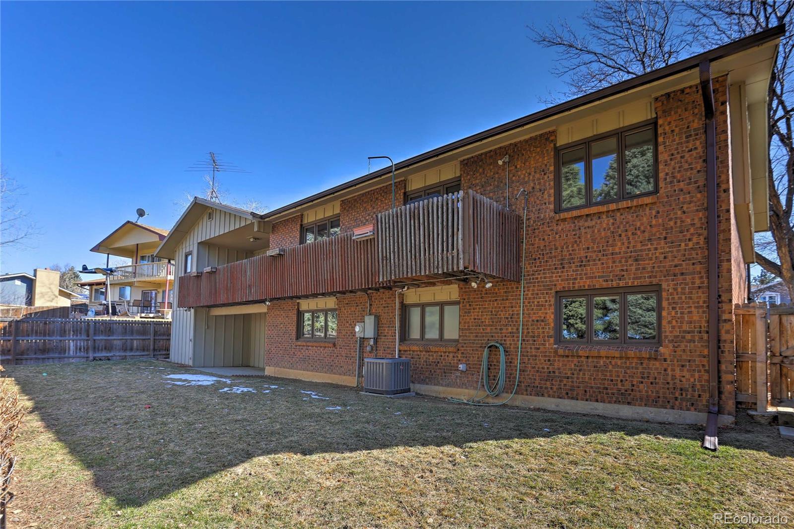4452 South Xeric Way Denver, CO 80237 - Photo 40 of 40 a front view of a house with garden