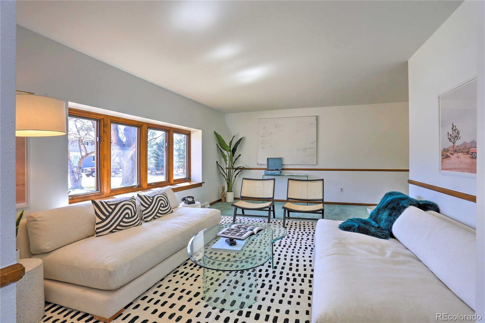 4452 South Xeric Way Denver, CO 80237 - Photo 4 of 40 a living room with furniture and a large window
