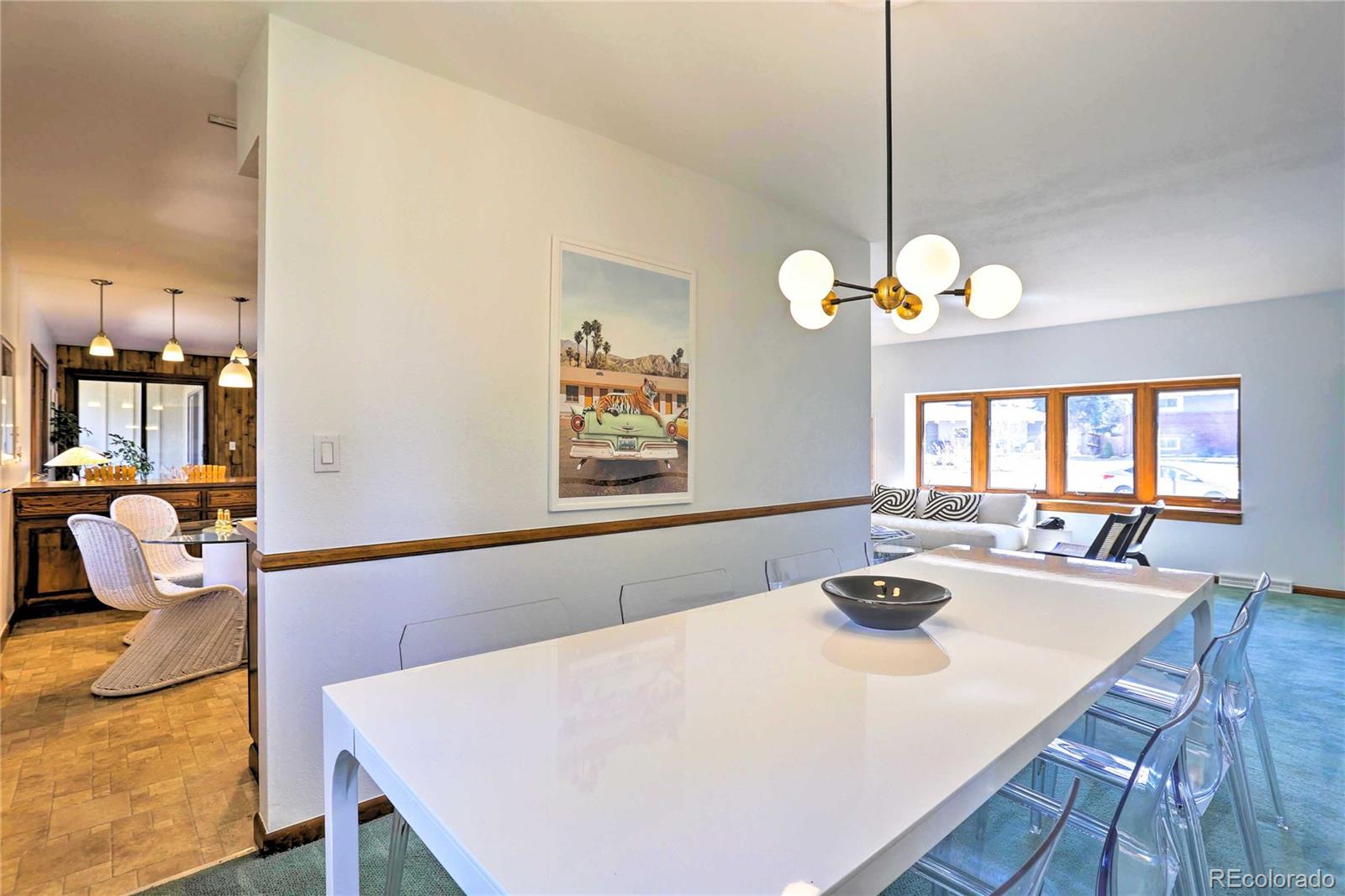 4452 South Xeric Way Denver, CO 80237 - Photo 7 of 40 a view of a dining room and livingroom