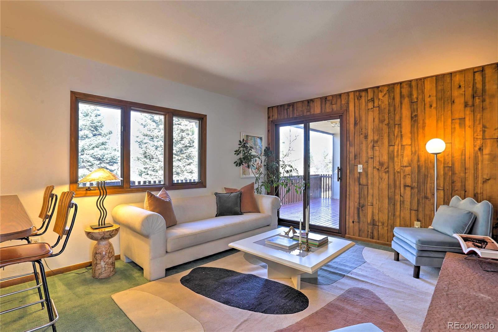 4452 South Xeric Way Denver, CO 80237 - Photo 9 of 40 a living room with furniture and a large window