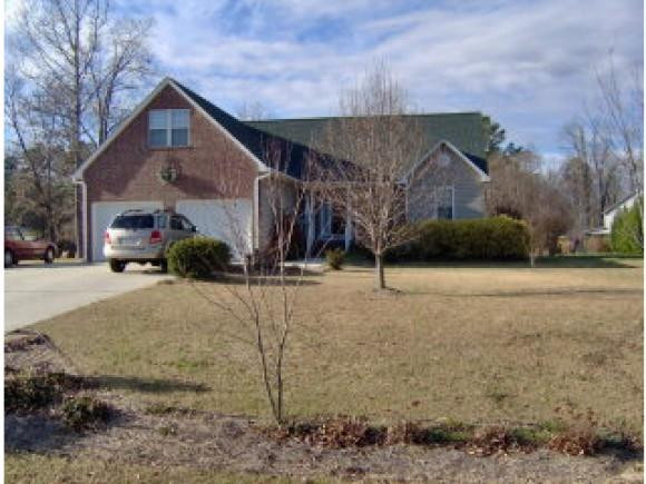 396 Cypress Farm Road Cameron, NC 28326 - Photo 1 of 1 a front view of a house with a yard and garage