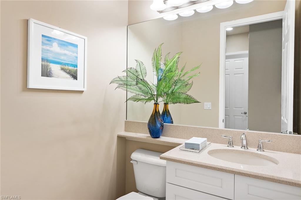 13338 Coronado Drive Naples, FL 34109 - Photo 11 of 22 a bathroom with a sink a vanity and a mirror
