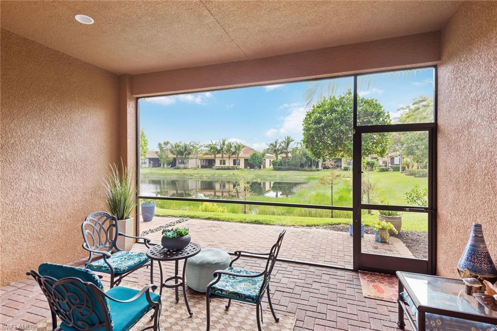 13338 Coronado Drive Naples, FL 34109 - Photo 12 of 22 a view of a city from a chairs and table in a room