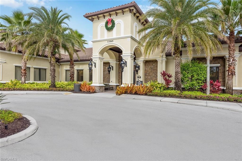 13338 Coronado Drive Naples, FL 34109 - Photo 14 of 22 front view of white house with a small yard