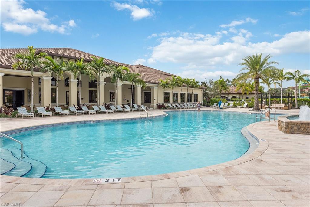 13338 Coronado Drive Naples, FL 34109 - Photo 17 of 22 a view of a swimming pool with outdoor seating