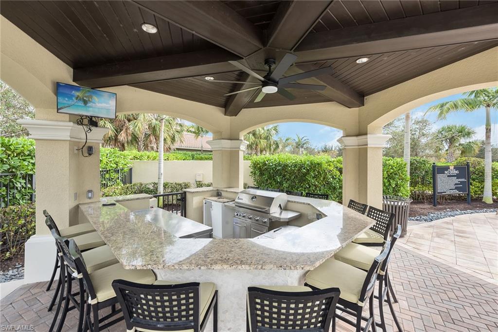 13338 Coronado Drive Naples, FL 34109 - Photo 19 of 22 a outdoor dining space with furniture and garden view