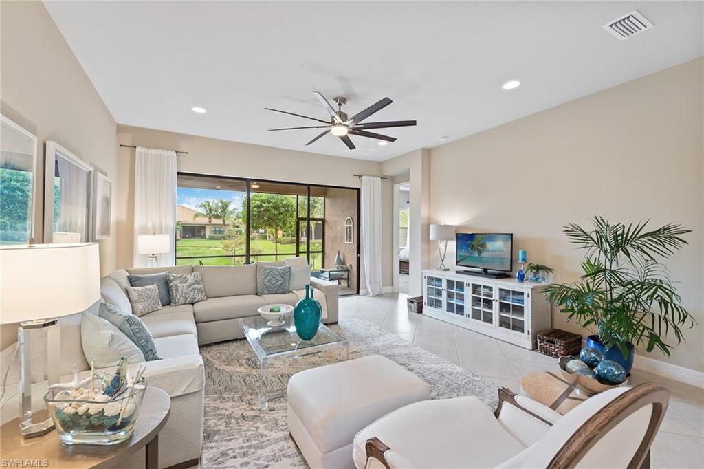 13338 Coronado Drive Naples, FL 34109 - Photo 2 of 22 a living room with furniture potted plant and a large window
