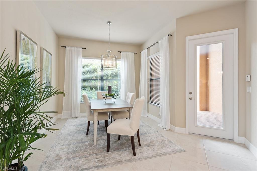 13338 Coronado Drive Naples, FL 34109 - Photo 5 of 22 a view of a livingroom with furniture and a potted plant