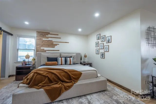 a bedroom with a bed and window