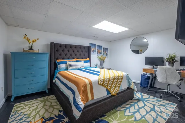 a bedroom with a bed and dresser