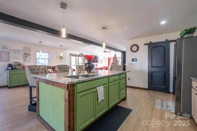 a kitchen with lots of counter top space and stainless steel appliances