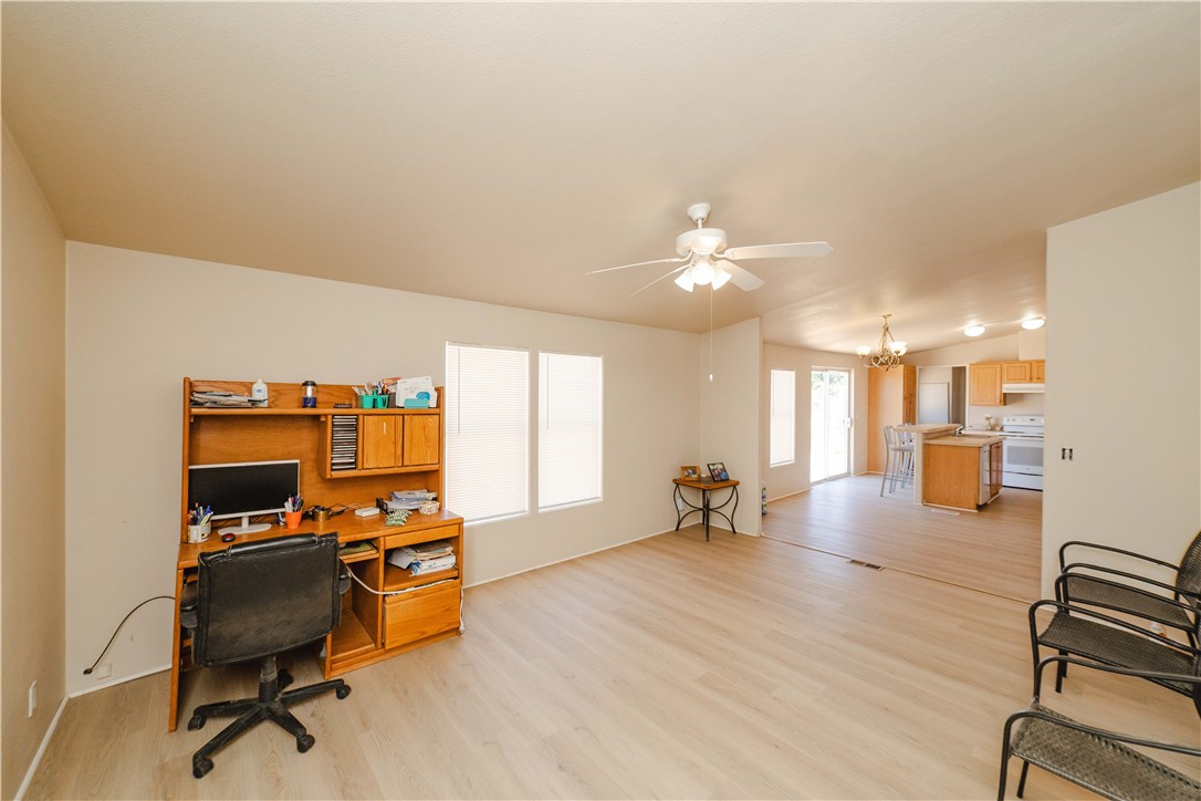4729 Stewart Mountain Road Golden Valley, AZ 86413 - Photo 10 of 28 a living room with furniture and a flat screen tv