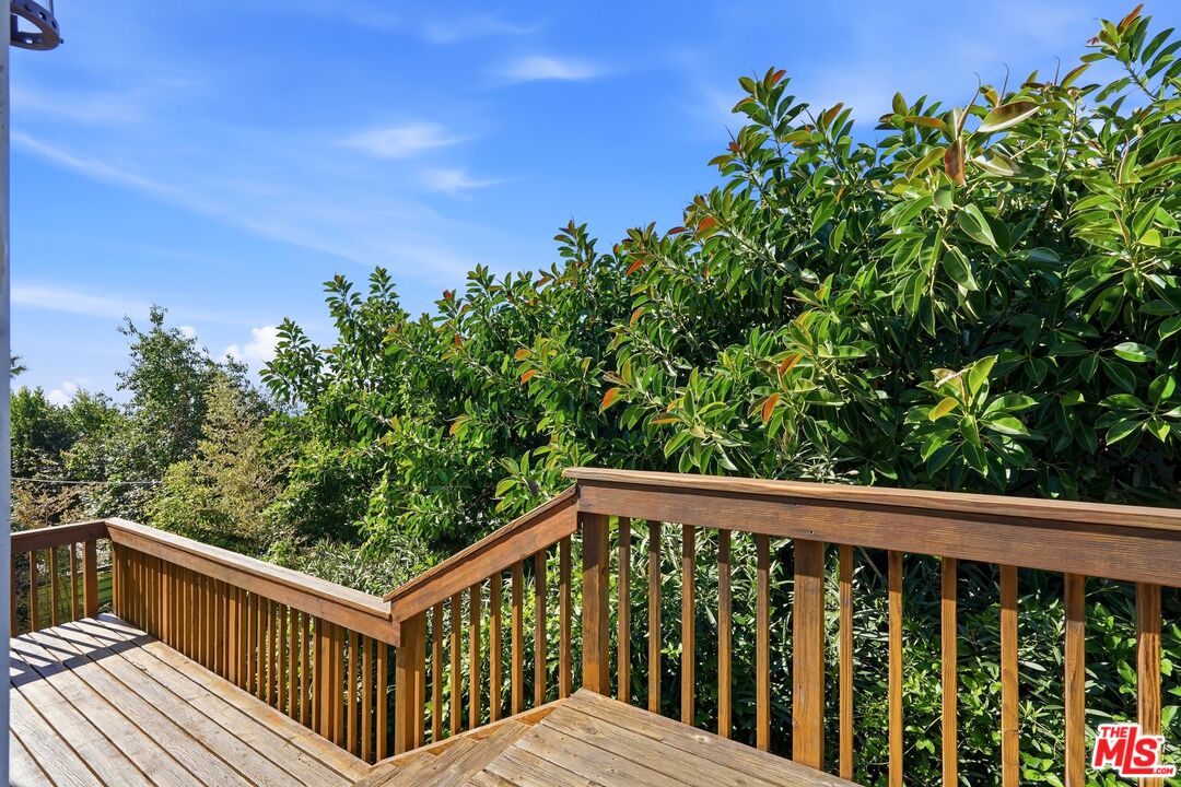 2955 Corral Canyon Road Malibu, CA 90265 - Photo 7 of 21 a view of a balcony with wooden fence