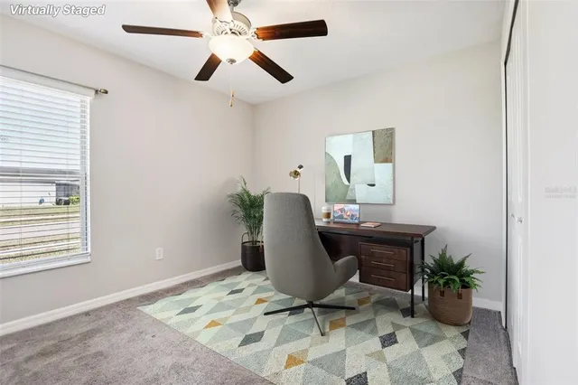 a workspace with furniture and window