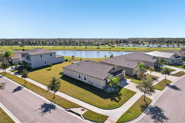 an aerial view of a house with a ocean view