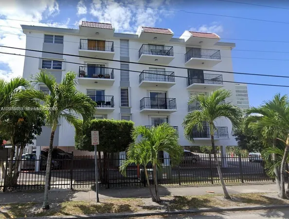 a front view of a building with street view