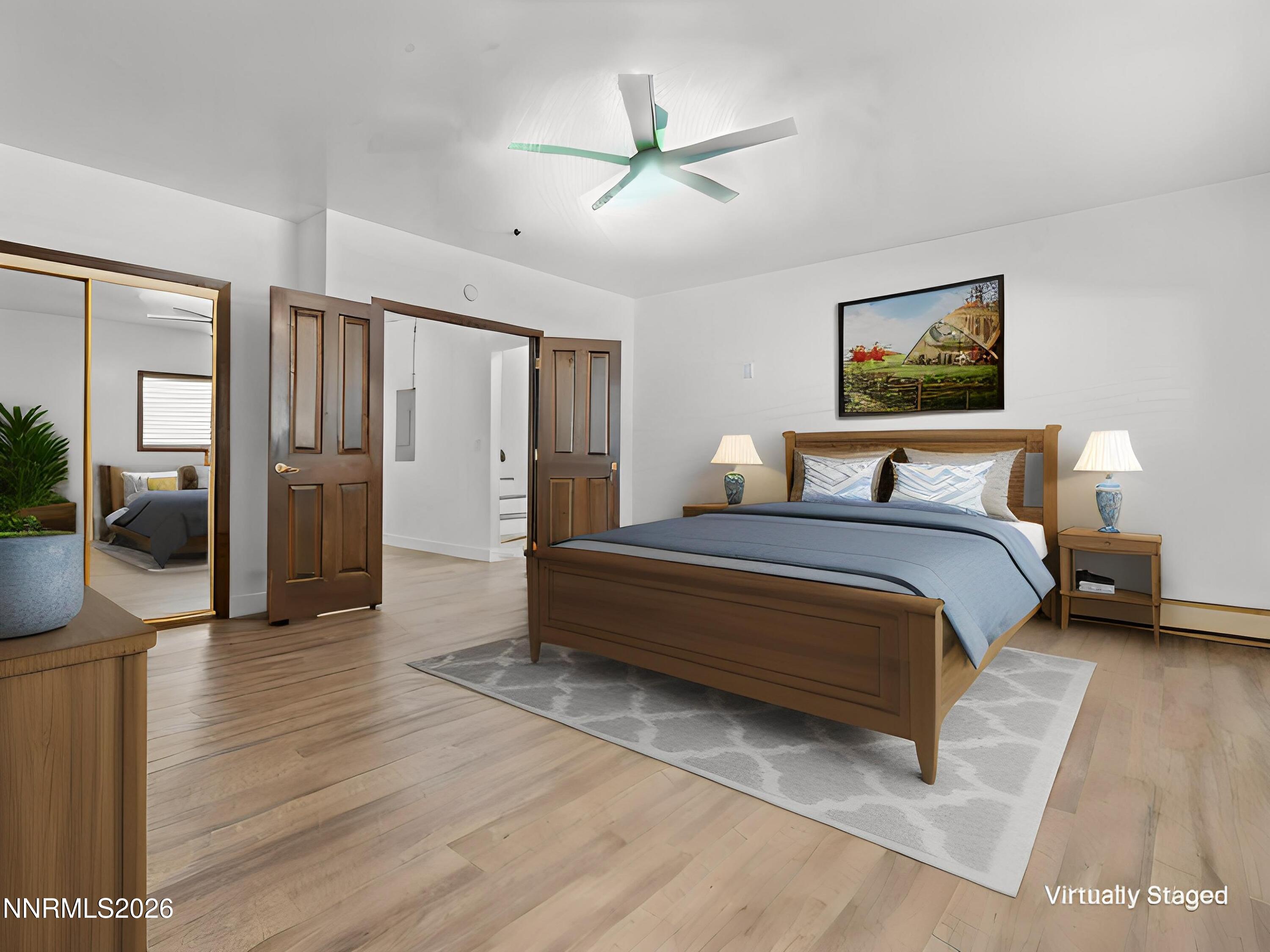 20449 Temelec Way Reno, NV 89521 - Photo 38 of 65 a bedroom with a bed and glass walk in closet