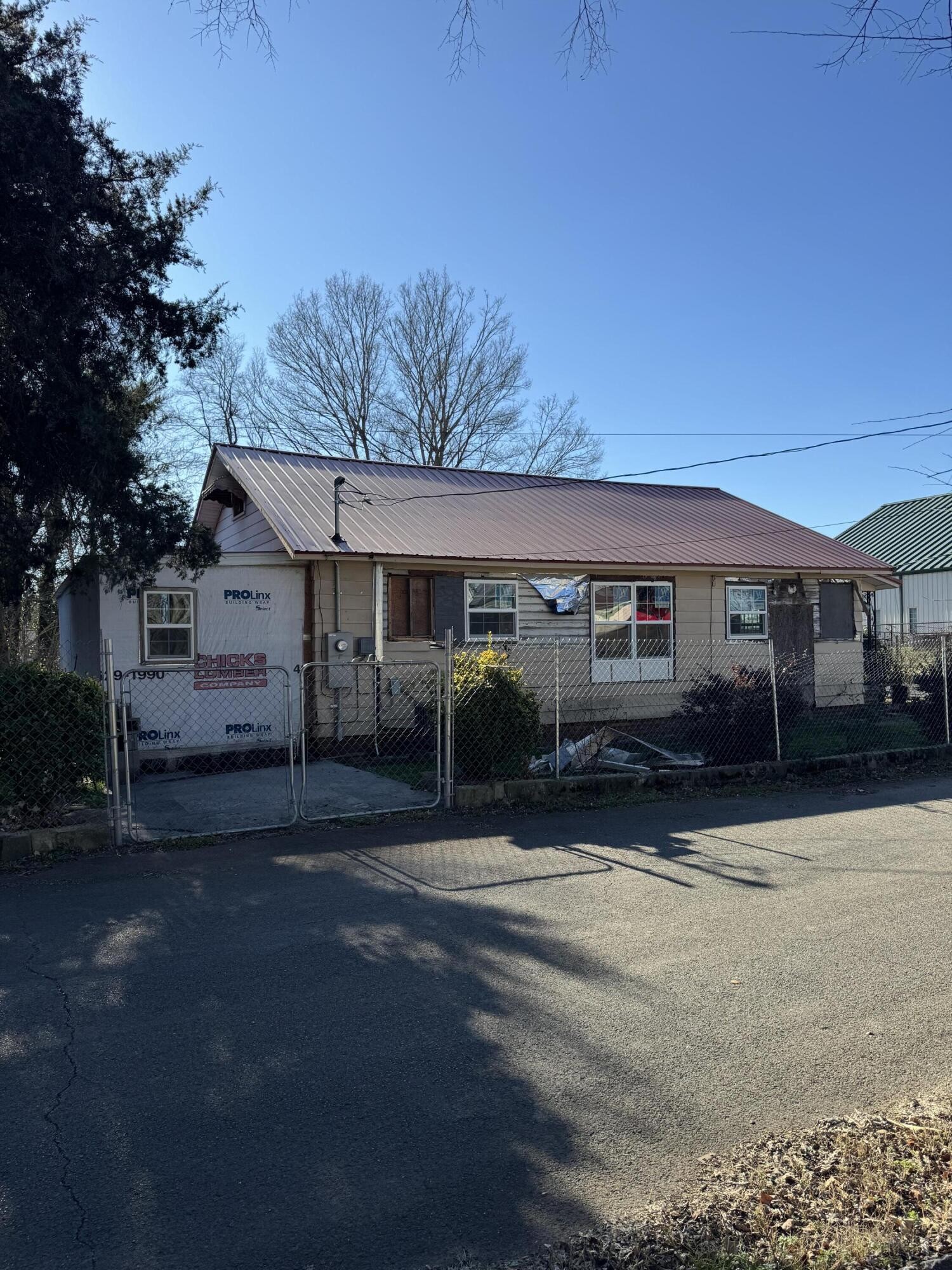 380 4th Street Northeast Cleveland, TN 37311 - Photo 3 of 6 a front view of a house with a garden