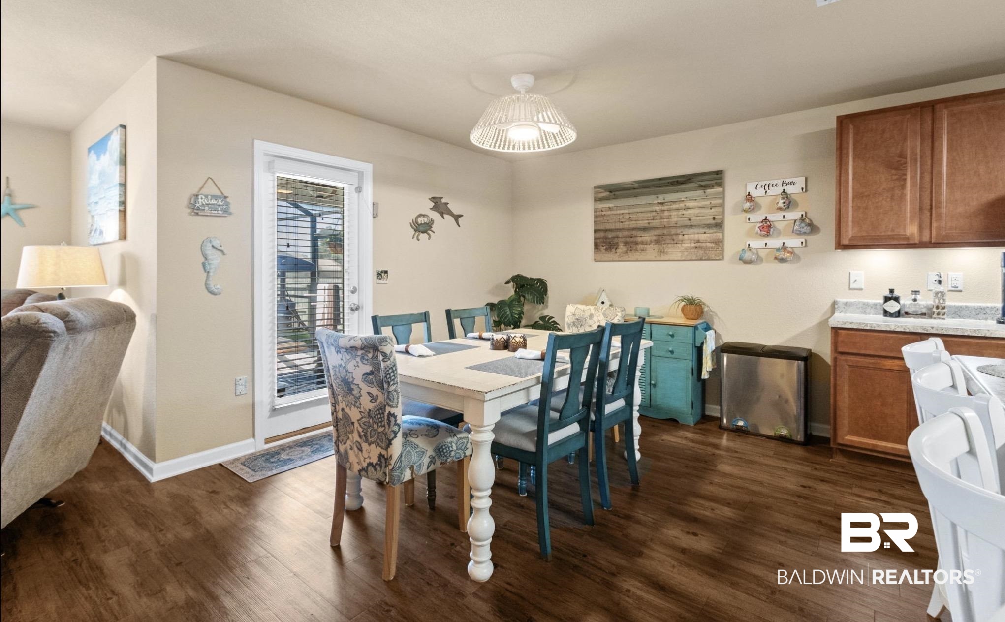 1676 Abbey Loop Foley, AL 36535 - Photo 8 of 31 Dining area with wood-finish flooring and a white ceiling light fixture