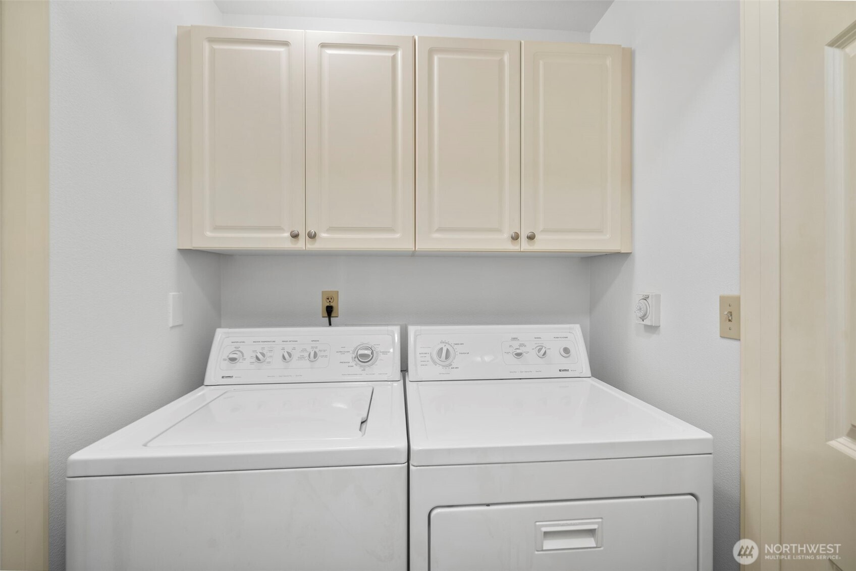 4310 Northeast 5th Court, Unit 101 Renton, WA 98059 - Photo 11 of 16 a view of storage and utility room with washer and dryer