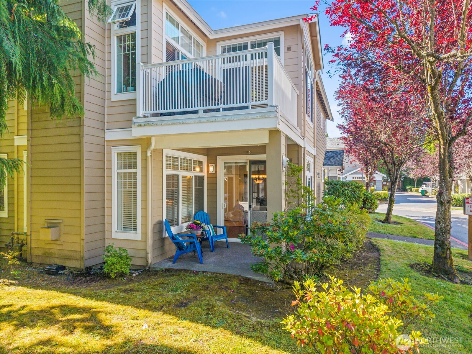 4310 Northeast 5th Court, Unit 101 Renton, WA 98059 - Photo 13 of 16 a view of a house with backyard and sitting area