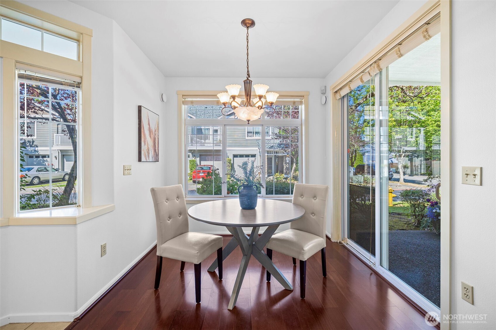4310 Northeast 5th Court, Unit 101 Renton, WA 98059 - Photo 4 of 16 a dining room with furniture window and wooden floor