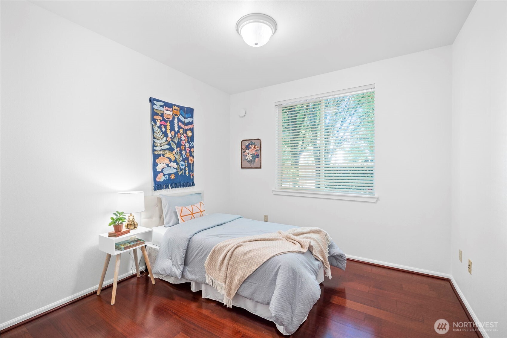 4310 Northeast 5th Court, Unit 101 Renton, WA 98059 - Photo 6 of 16 a bedroom with a bed and a window