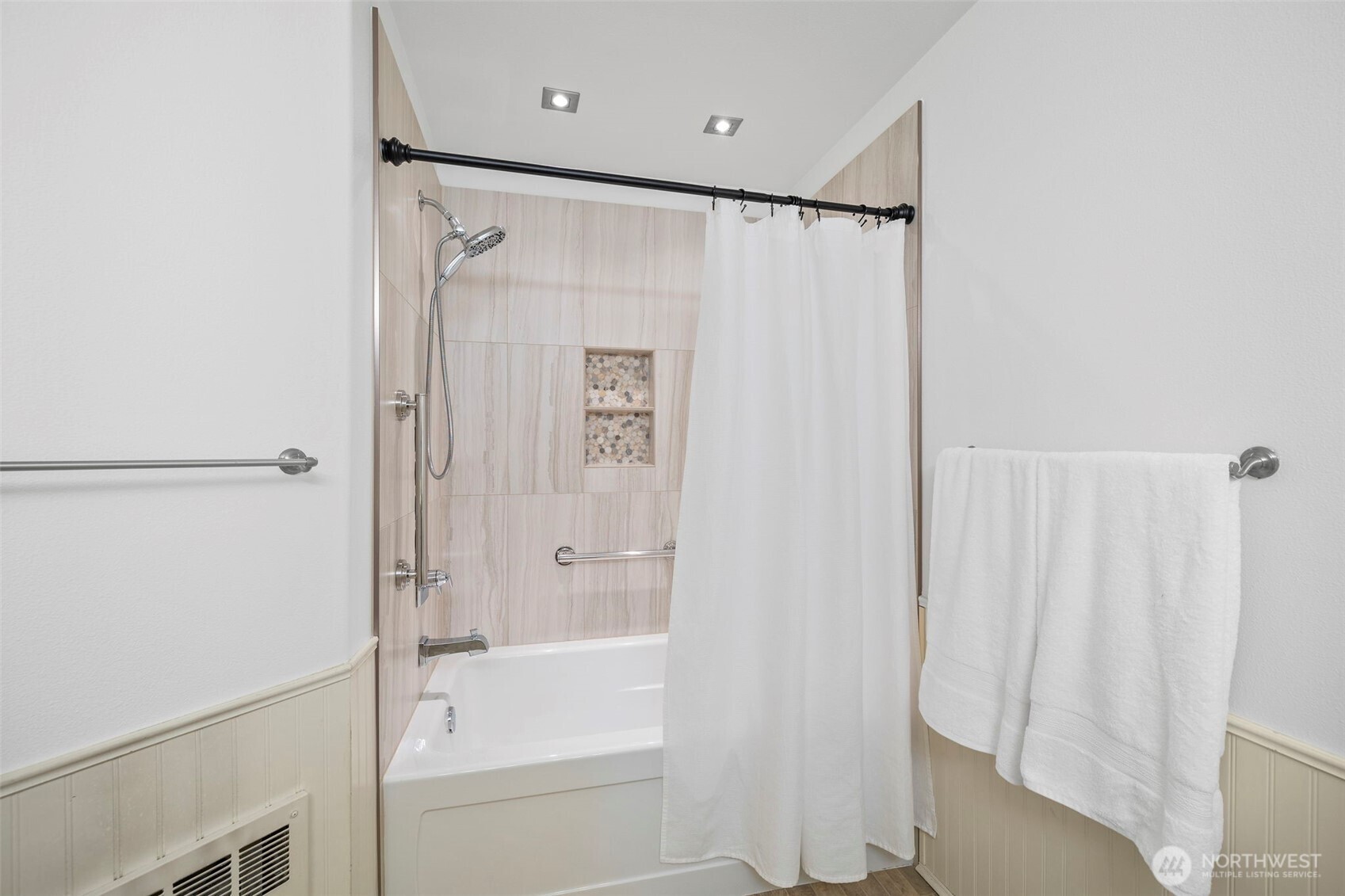 4310 Northeast 5th Court, Unit 101 Renton, WA 98059 - Photo 8 of 16 a bathroom with a shower and a bath tub