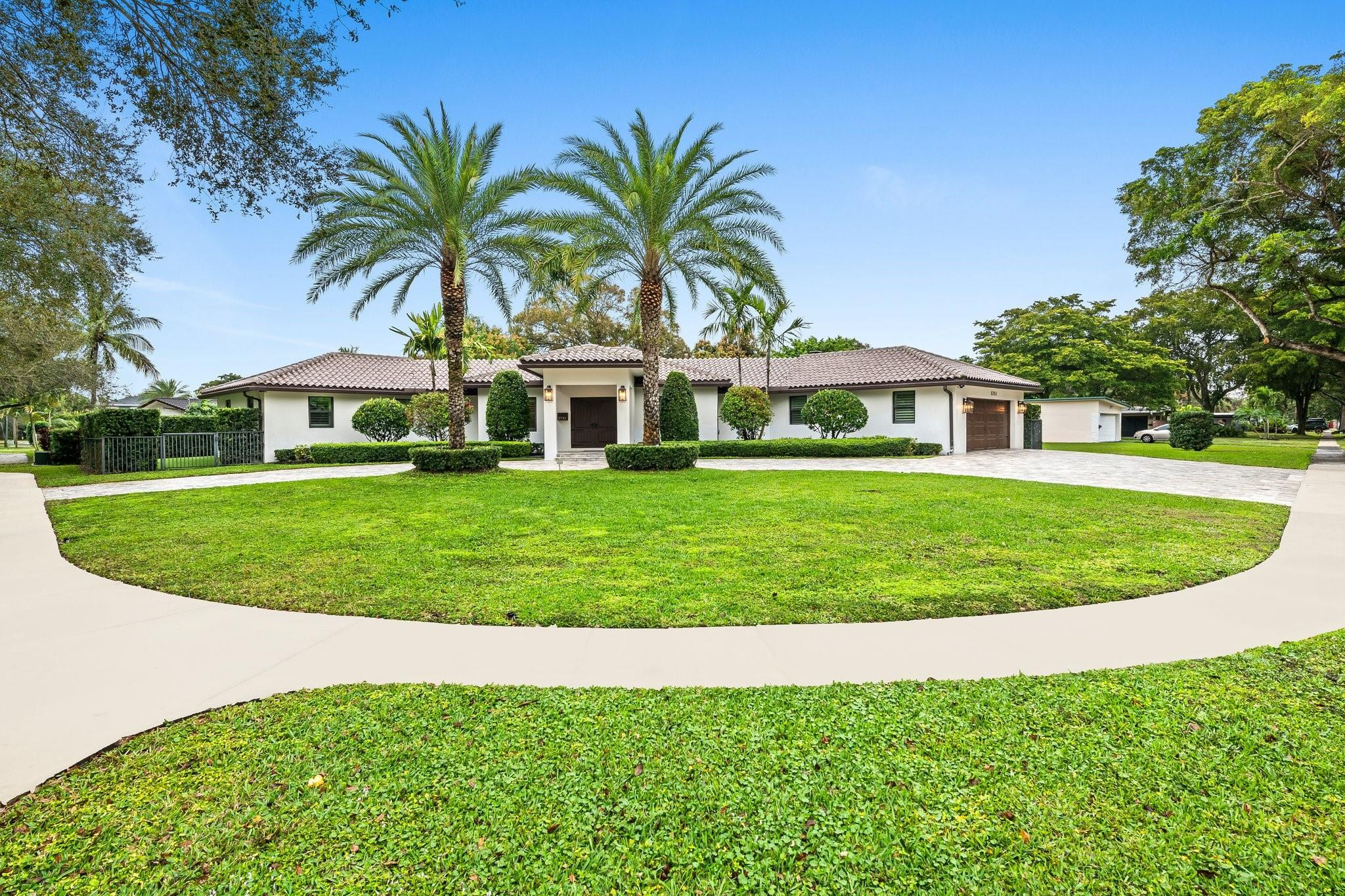 front view of a house with a garden