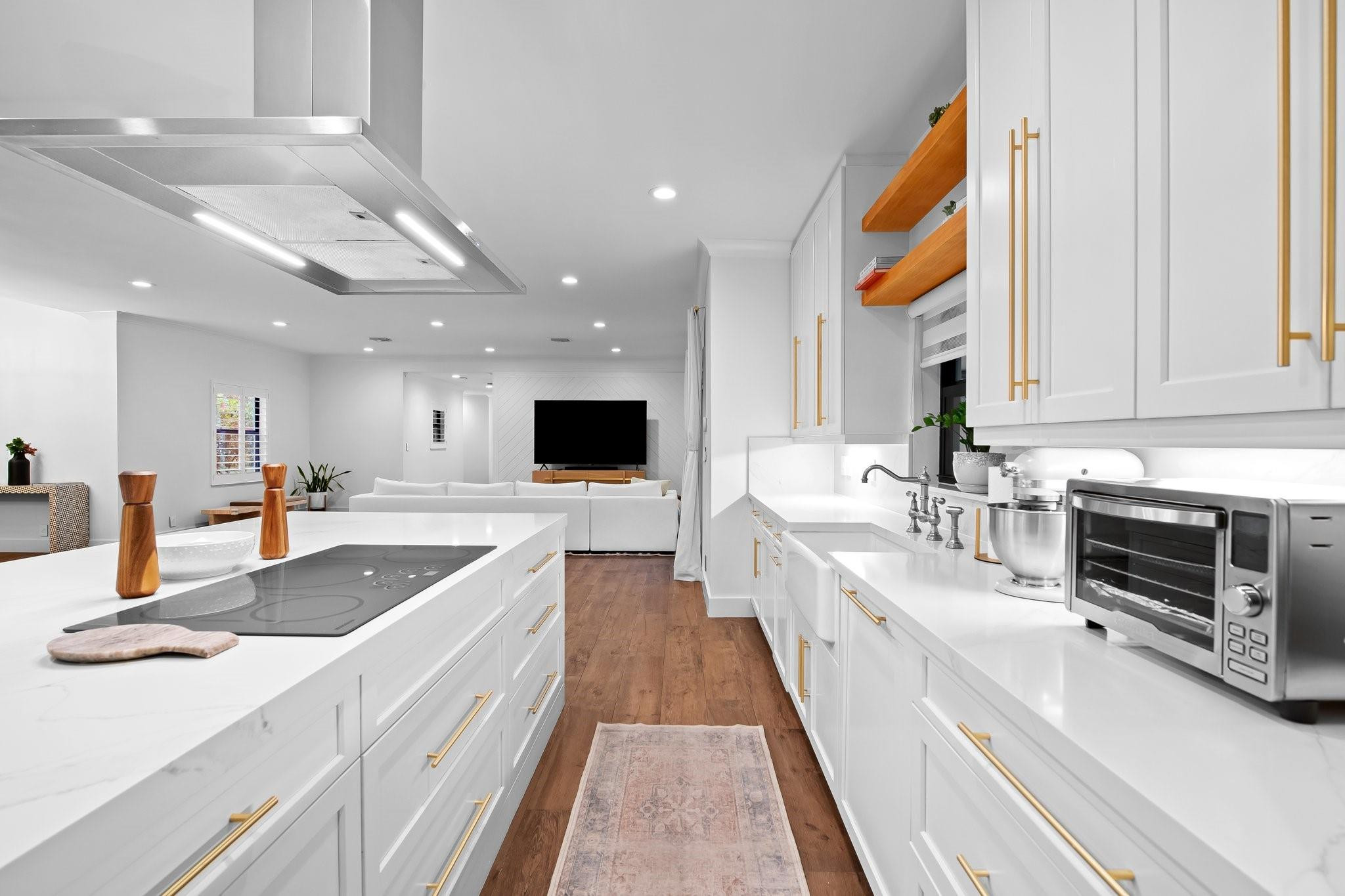 5751 Plantation Road Plantation, FL 33317 - Photo 11 of 32 a large white kitchen with a large window